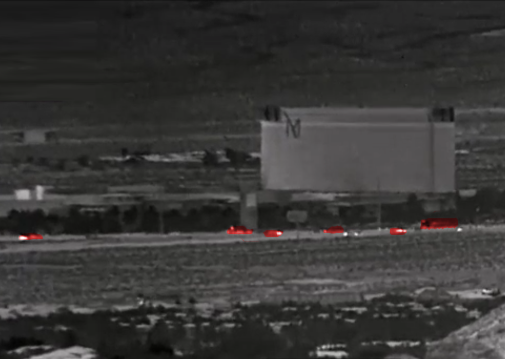 Vehicles viewed at 35 km through IR camera